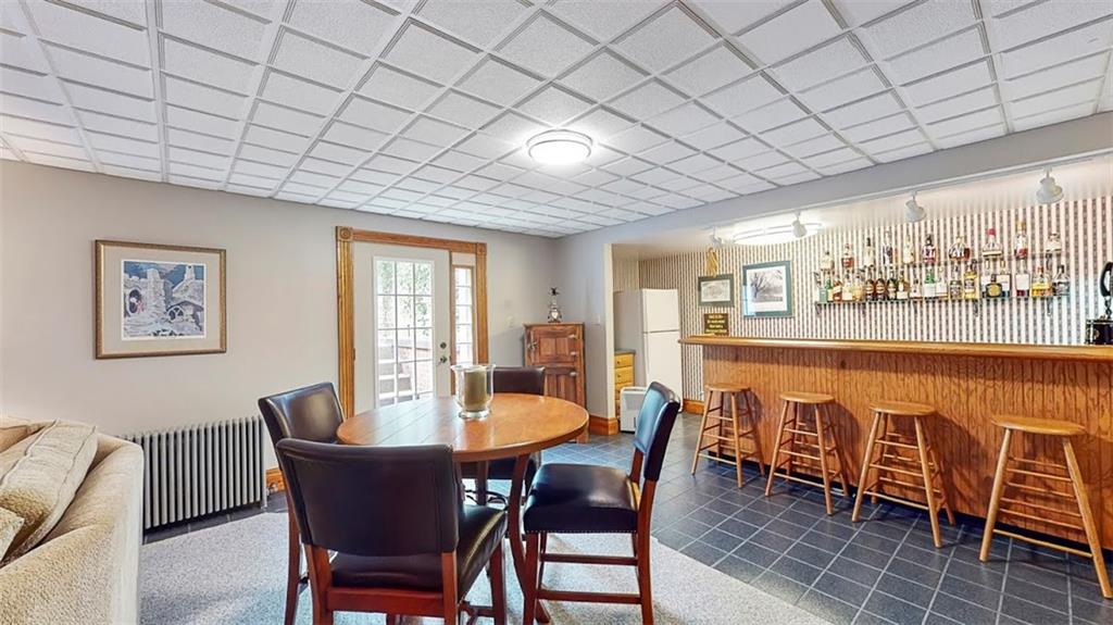 2163 Garards Fort Road Waynesburg, PA 15370 - Photo 23 of 25 a dining room with furniture a rug and a chandelier