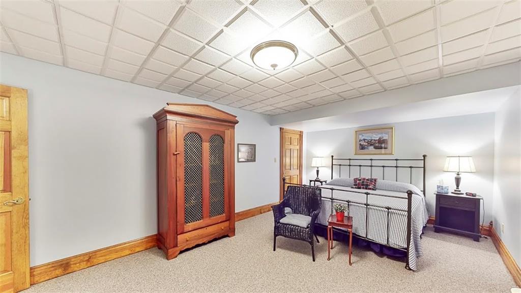 2163 Garards Fort Road Waynesburg, PA 15370 - Photo 24 of 25 a living room with furniture and a chandelier