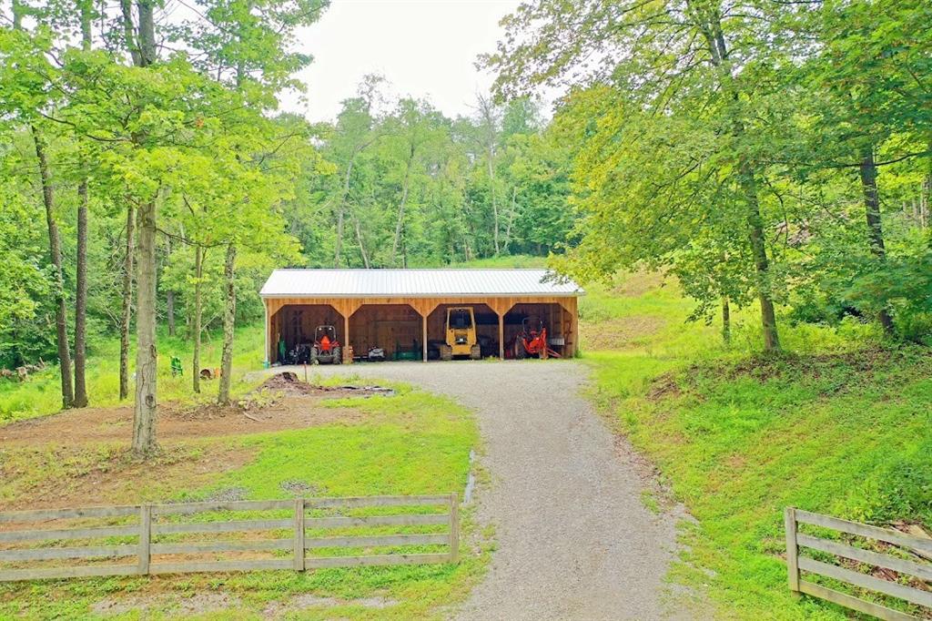 2163 Garards Fort Road Waynesburg, PA 15370 - Photo 6 of 25 a view of a yard with large trees
