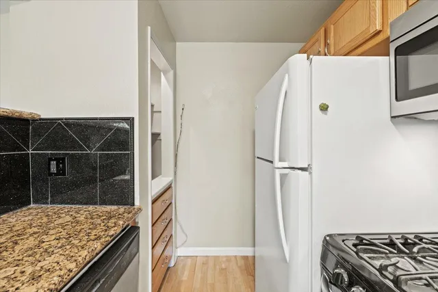 a view of kitchen island with wooden floor
