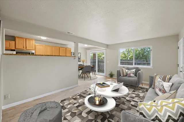 a living room with furniture and a window