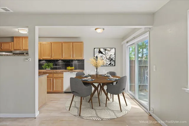 a view of a dining room with furniture window and outside view
