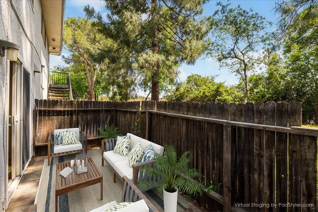 a view of balcony with furniture
