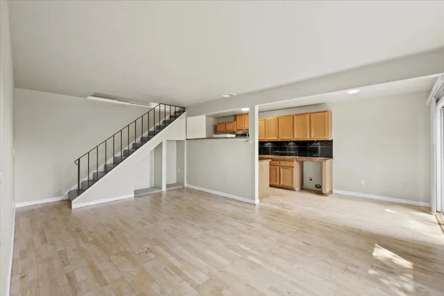 a view of wooden floor and an empty room