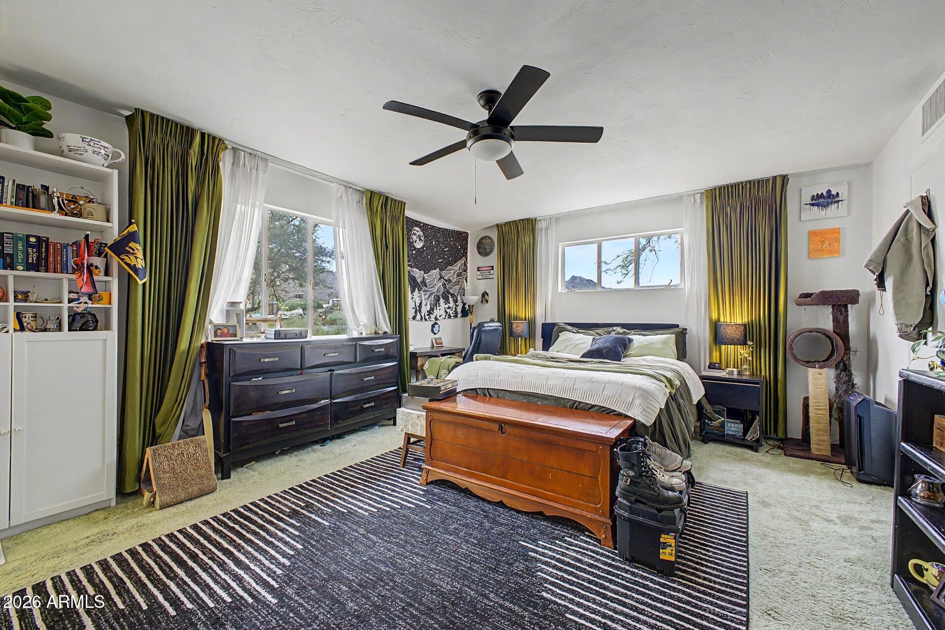 1702 East Griswold Road Phoenix, AZ 85020 - Photo 14 of 38 a bedroom with a bed and a window