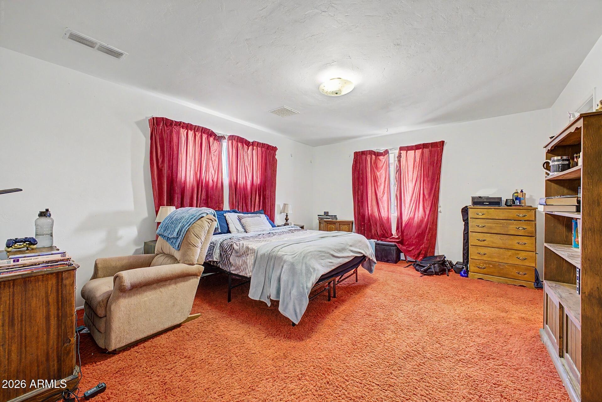 1702 East Griswold Road Phoenix, AZ 85020 - Photo 18 of 38 a bedroom with furniture and a large window