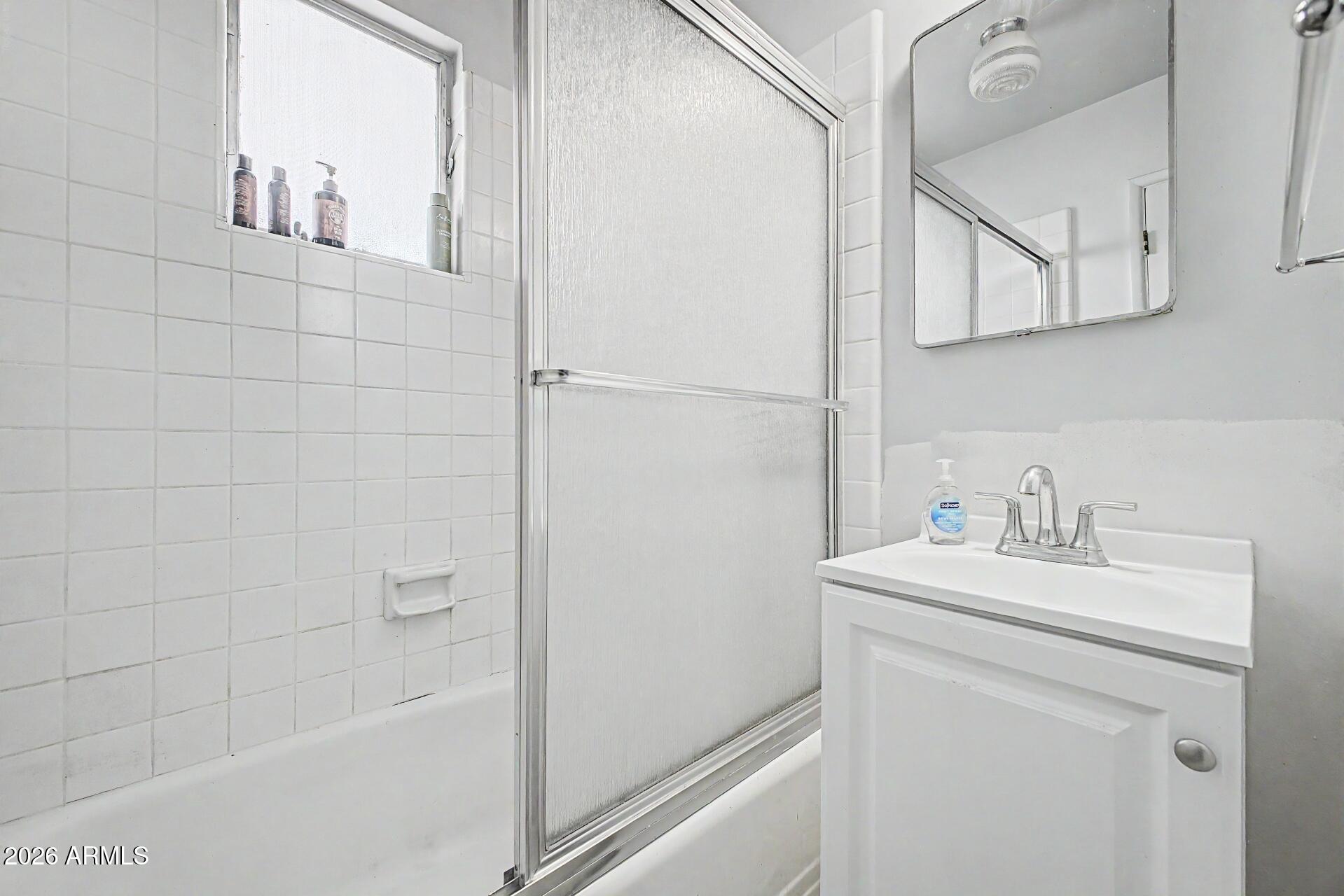 1702 East Griswold Road Phoenix, AZ 85020 - Photo 20 of 38 a bathroom with a sink a toilet and shower