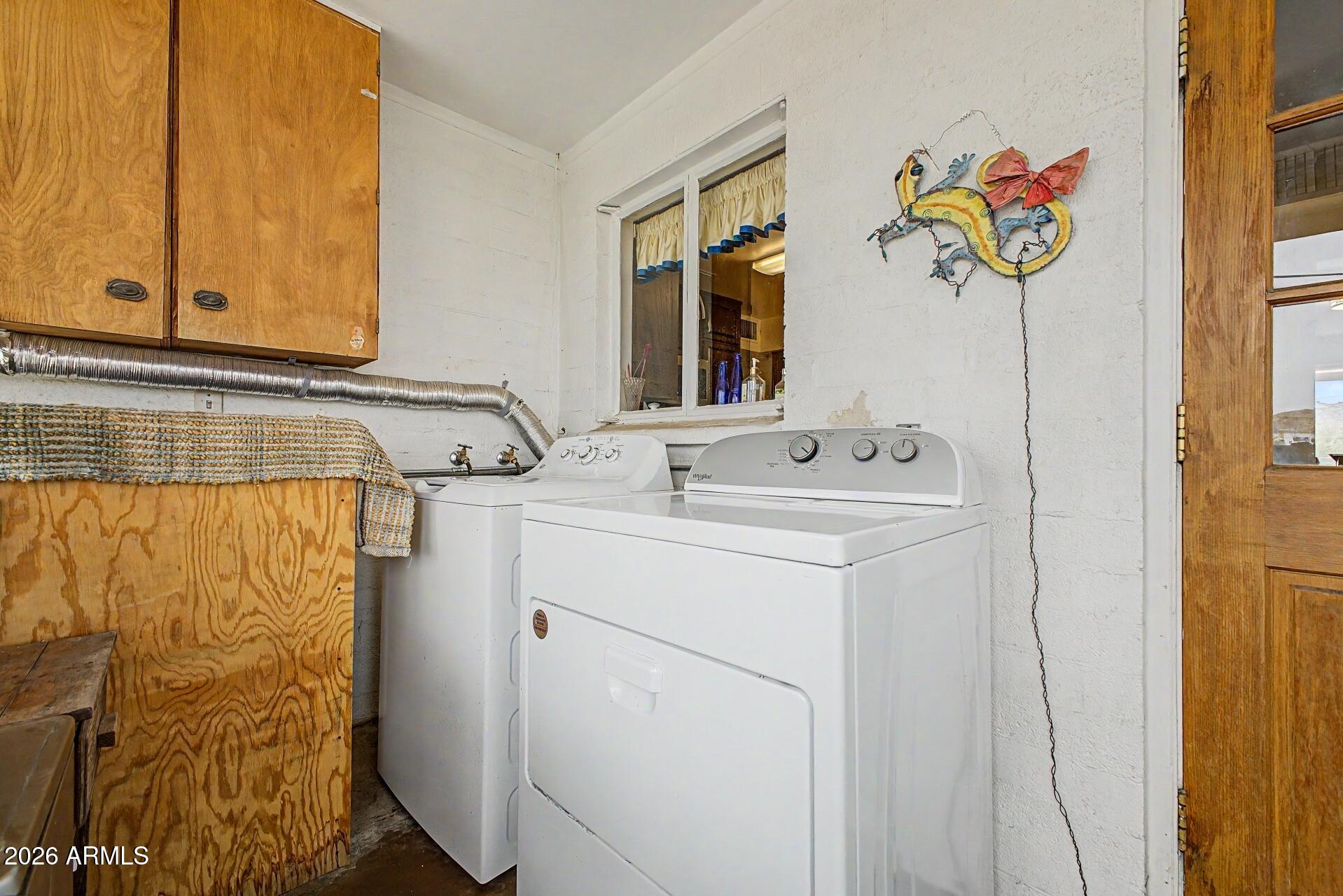 1702 East Griswold Road Phoenix, AZ 85020 - Photo 24 of 38 a utility room with a sink dryer and washer