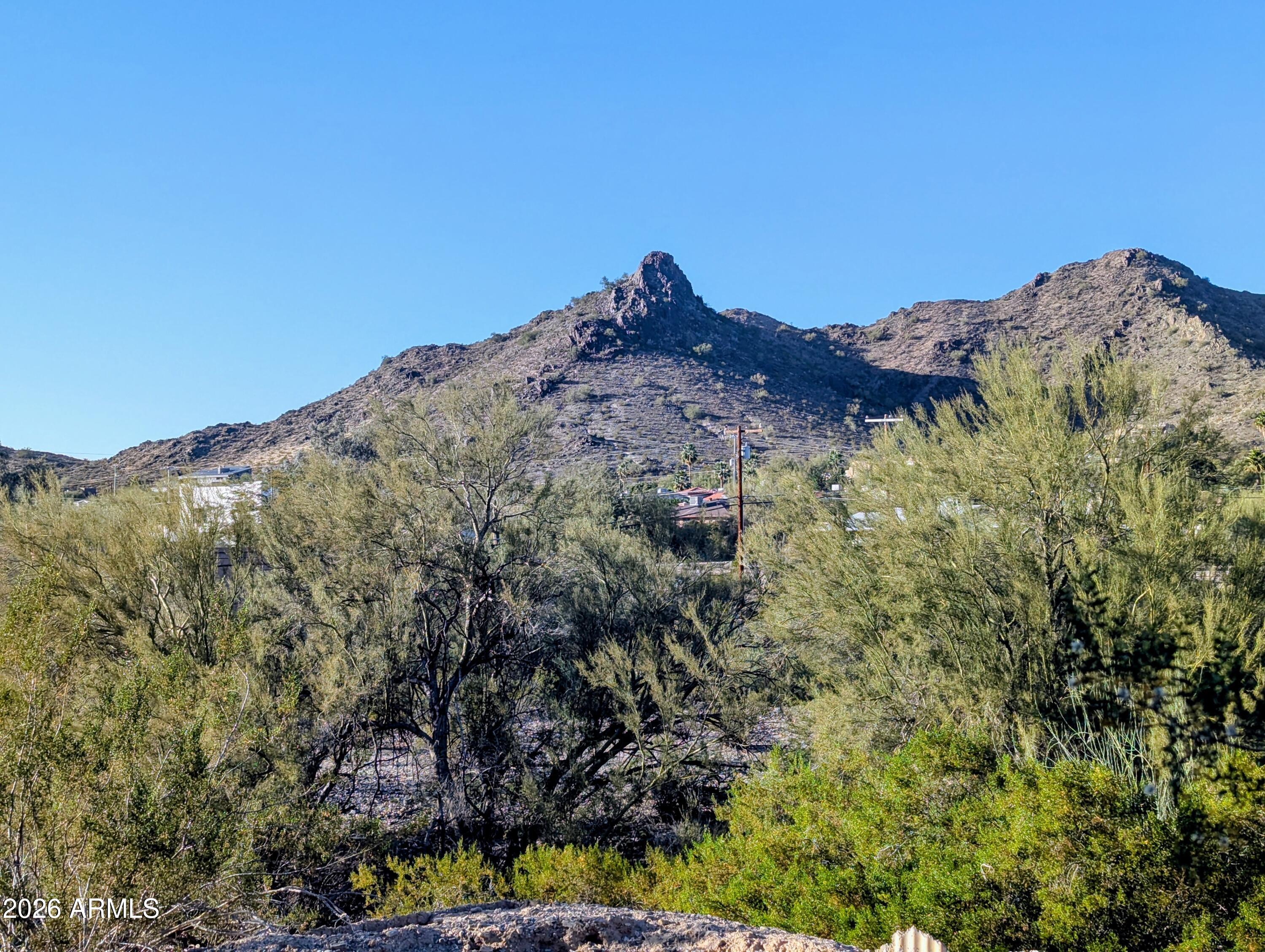 1702 East Griswold Road Phoenix, AZ 85020 - Photo 6 of 6 a view of a large building with a mountain in the background
