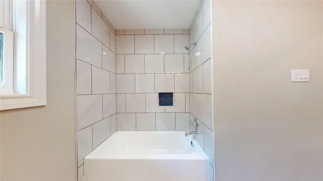 a bathroom with a bathtub