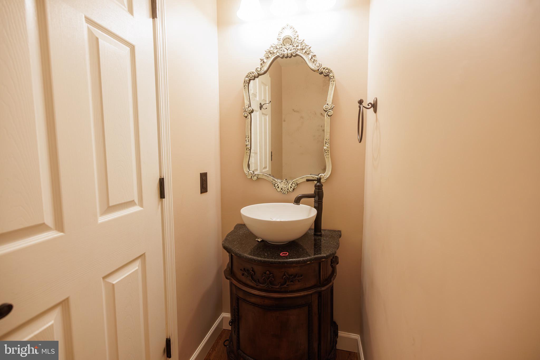 3022 Oak Drive Sinking Spring, PA 19608 - Photo 11 of 28 a bathroom with a sink and a mirror
