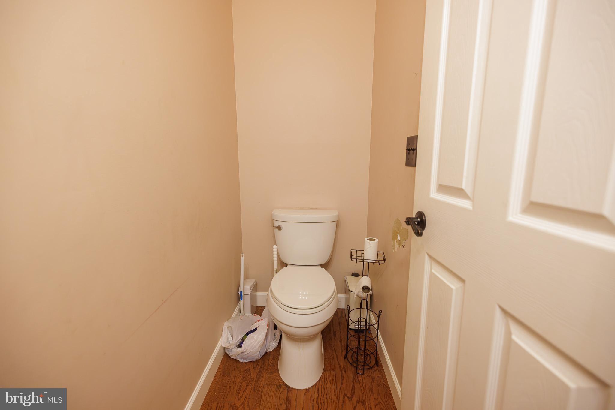 3022 Oak Drive Sinking Spring, PA 19608 - Photo 12 of 28 a white toilet sitting next to a small sink