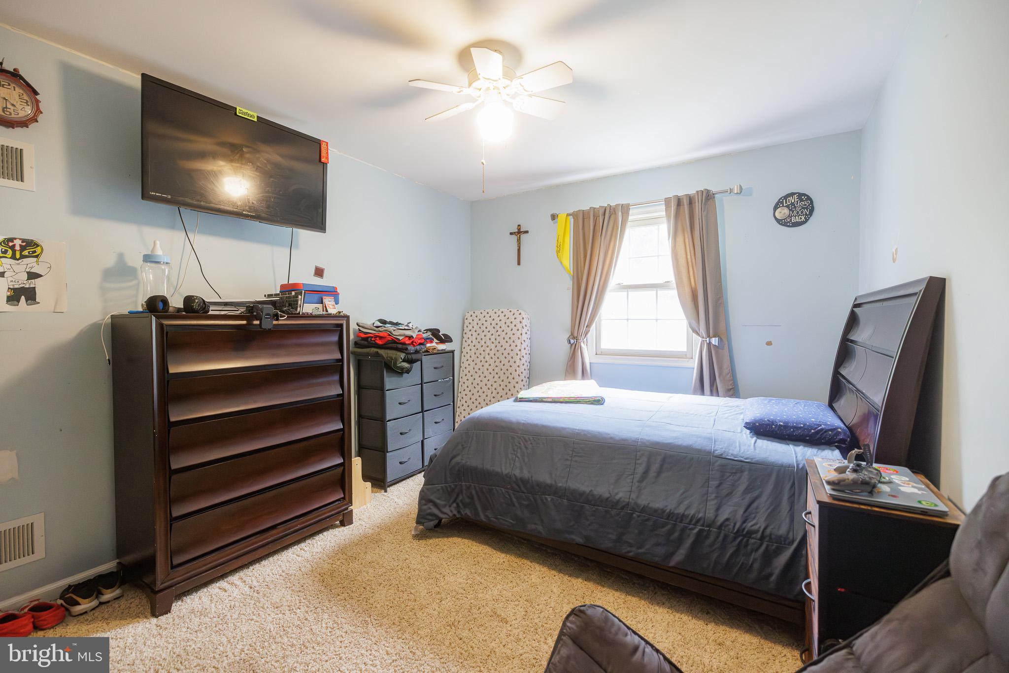 3022 Oak Drive Sinking Spring, PA 19608 - Photo 15 of 28 a bedroom with a bed and a flat screen tv