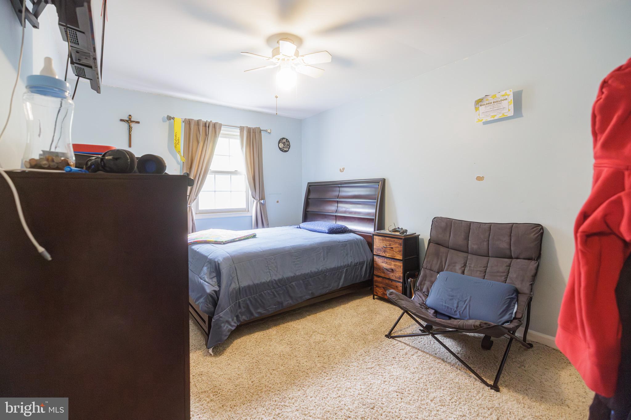 3022 Oak Drive Sinking Spring, PA 19608 - Photo 16 of 28 a bedroom with a bed window and chair