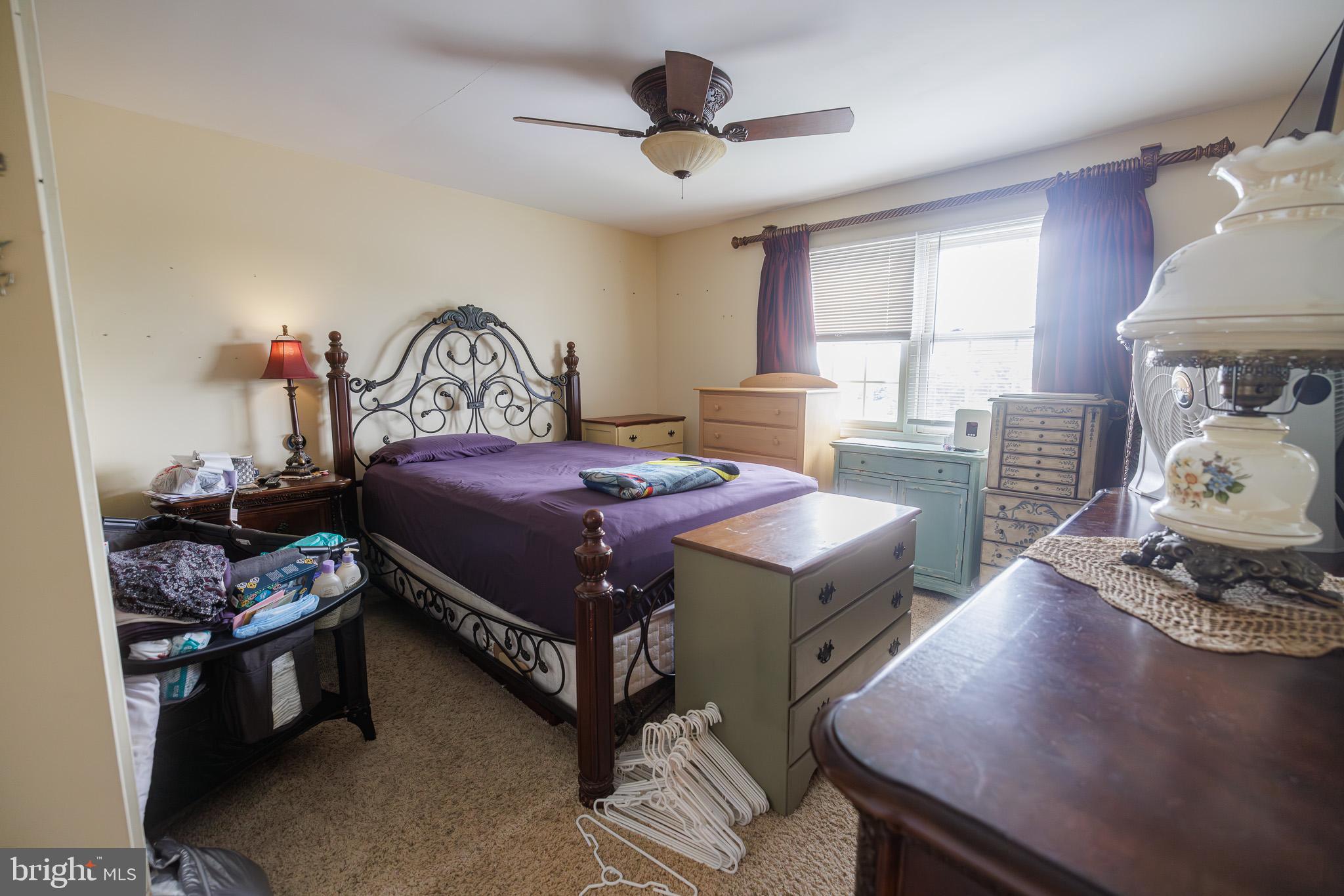 3022 Oak Drive Sinking Spring, PA 19608 - Photo 17 of 28 a bedroom with a bed and a chandelier