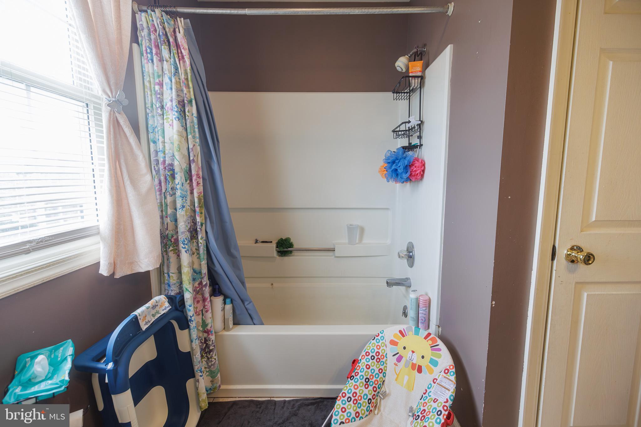 3022 Oak Drive Sinking Spring, PA 19608 - Photo 20 of 28 a white bath tub sitting next to a white sink