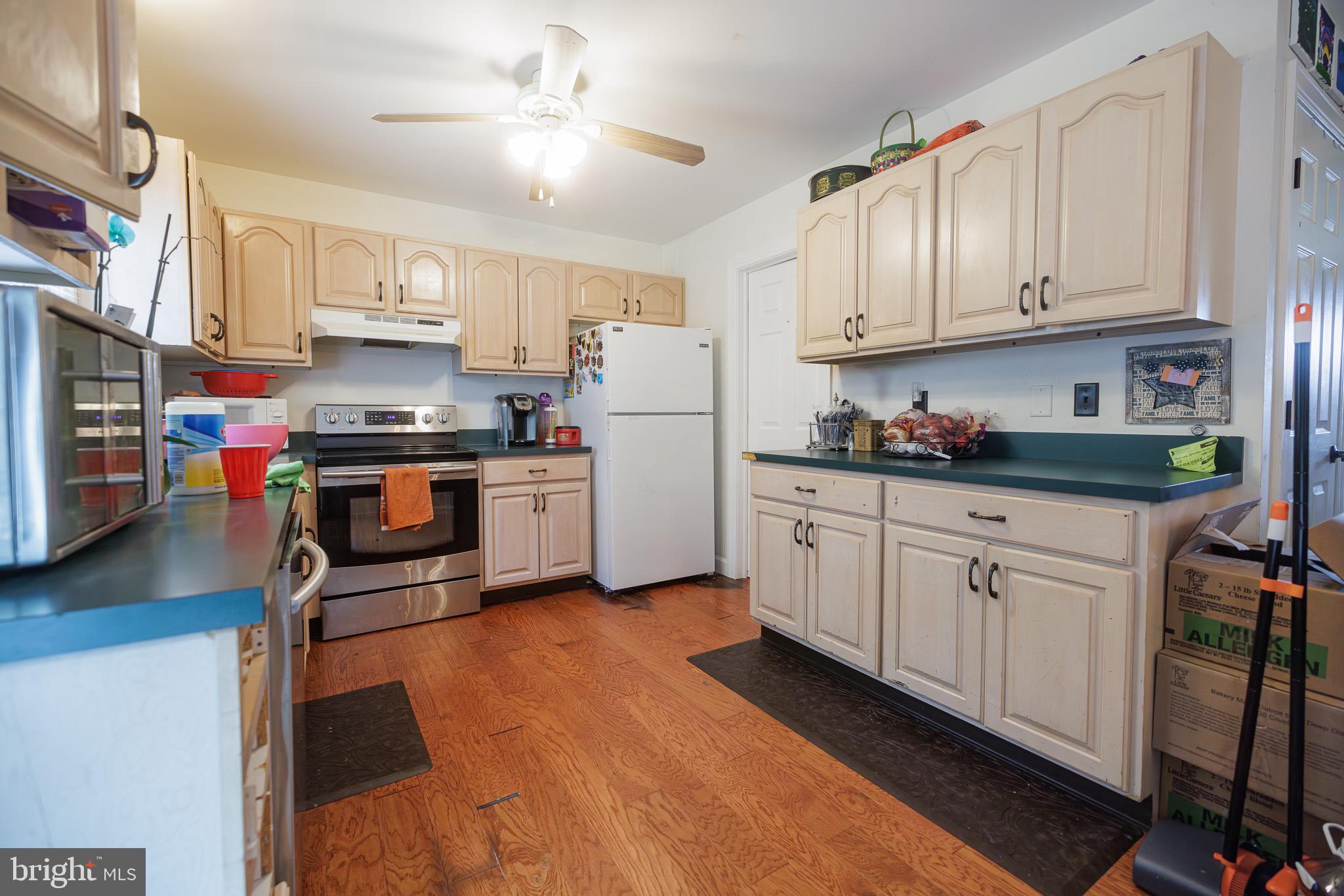 3022 Oak Drive Sinking Spring, PA 19608 - Photo 10 of 28 a kitchen with stainless steel appliances granite countertop a refrigerator sink and cabinets