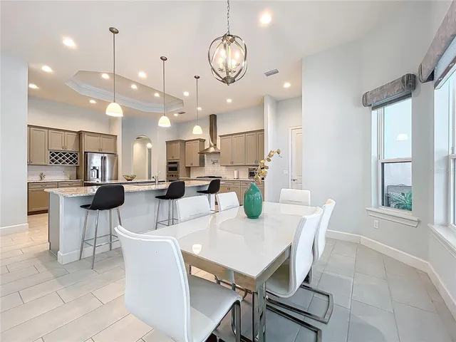 a view of a livingroom with workspace and a window