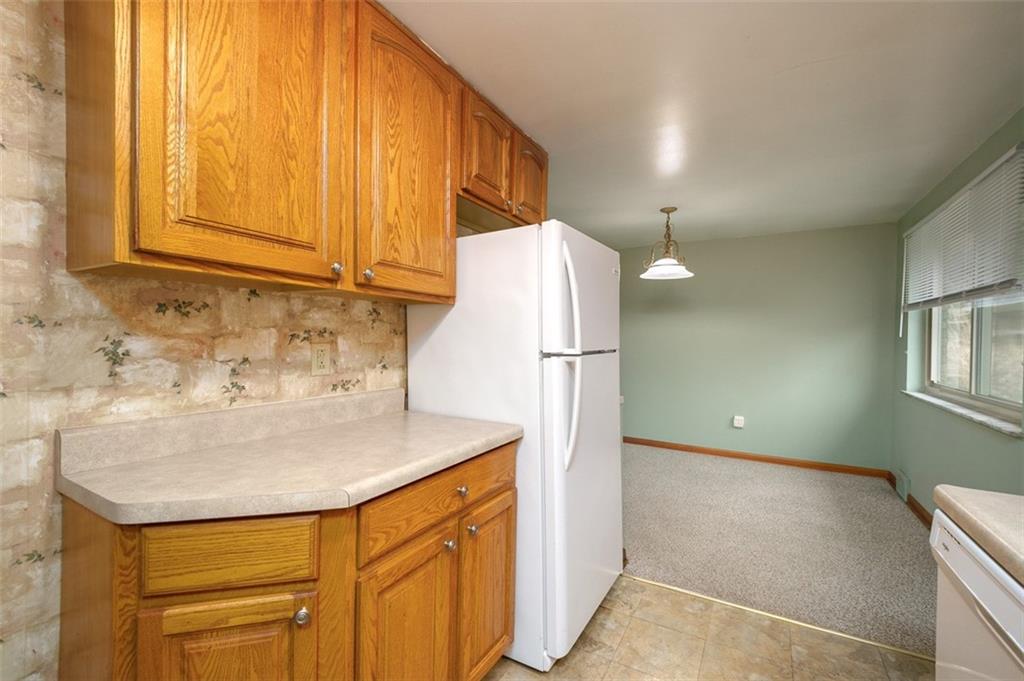 1870 Haymaker Road Monroeville, PA 15146 - Photo 9 of 20 a bathroom with a sink and a refrigerator