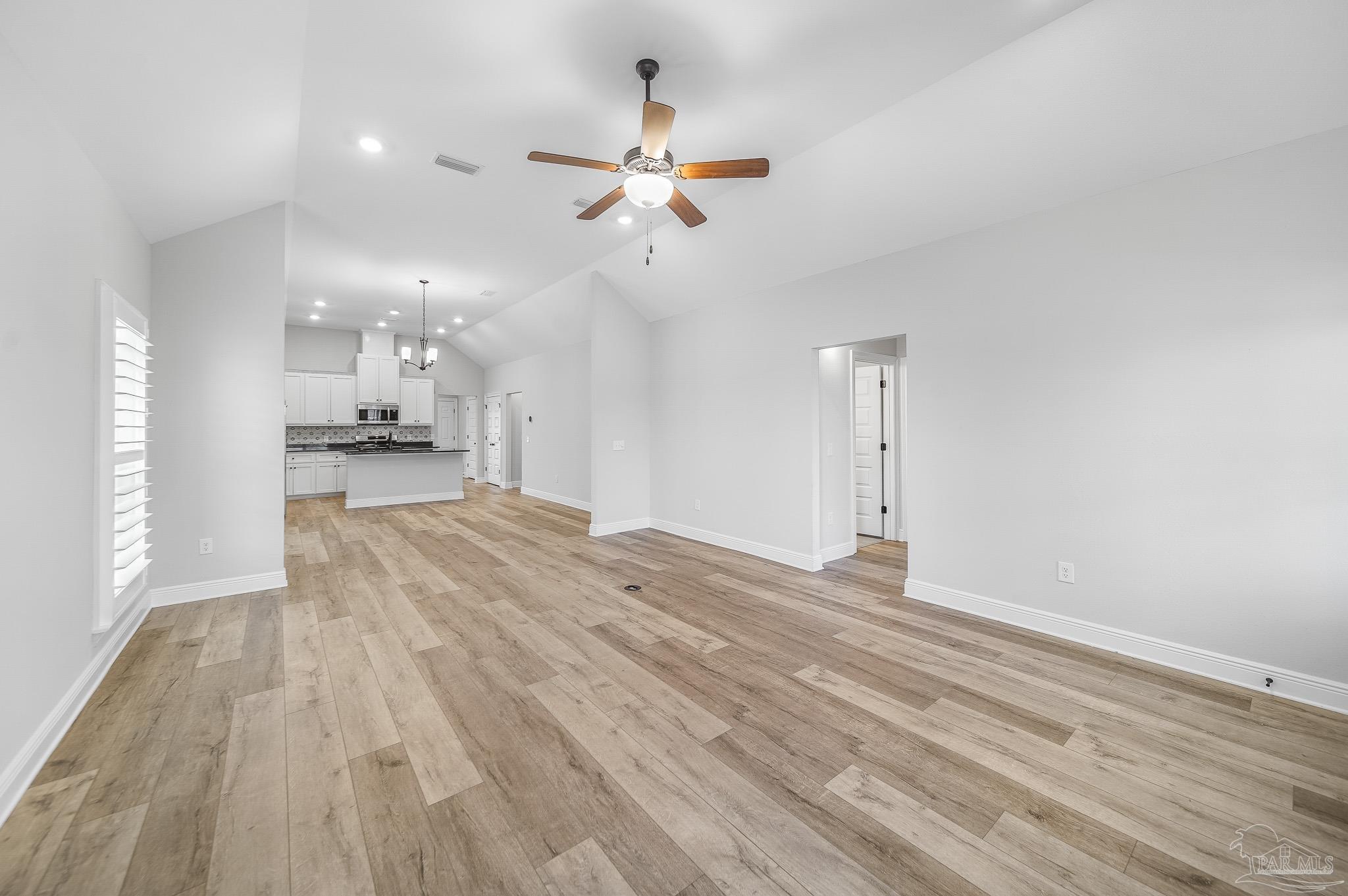 8977 Eureka Street Milton, FL 32583 - Photo 14 of 44 a view of a kitchen with a dishwasher and a stove