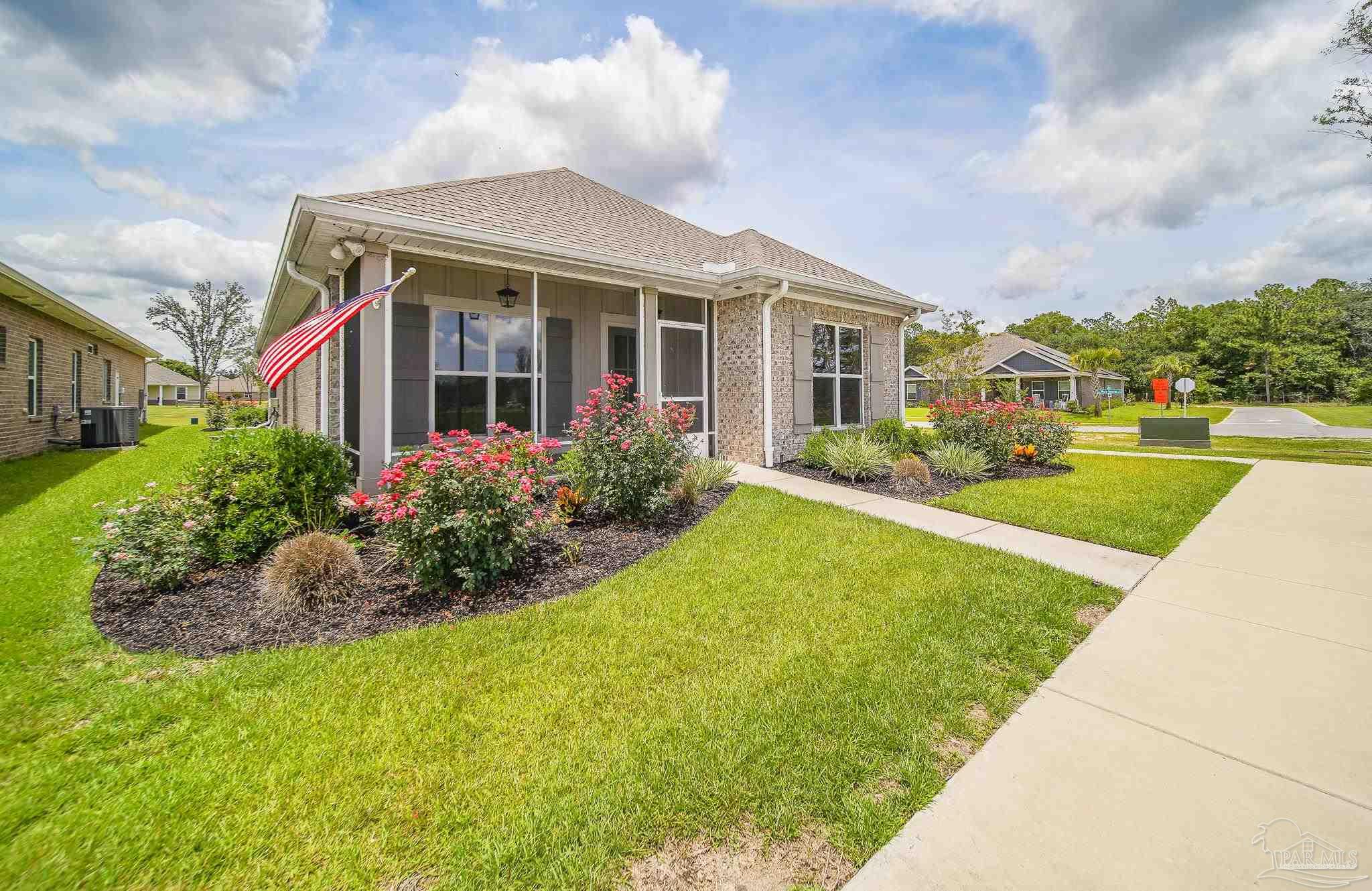 8977 Eureka Street Milton, FL 32583 - Photo 35 of 44 a front view of house with yard and green space