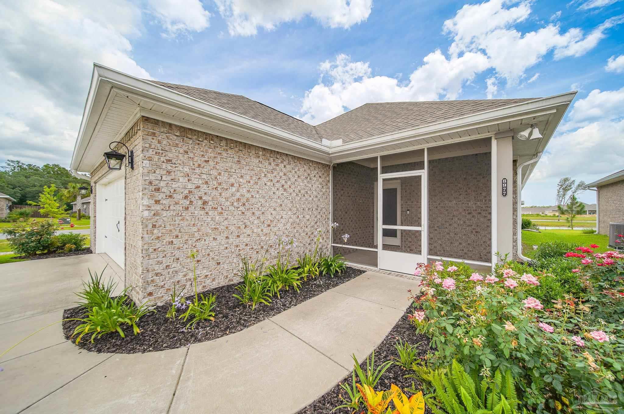 8977 Eureka Street Milton, FL 32583 - Photo 37 of 44 a front view of a house with a yard