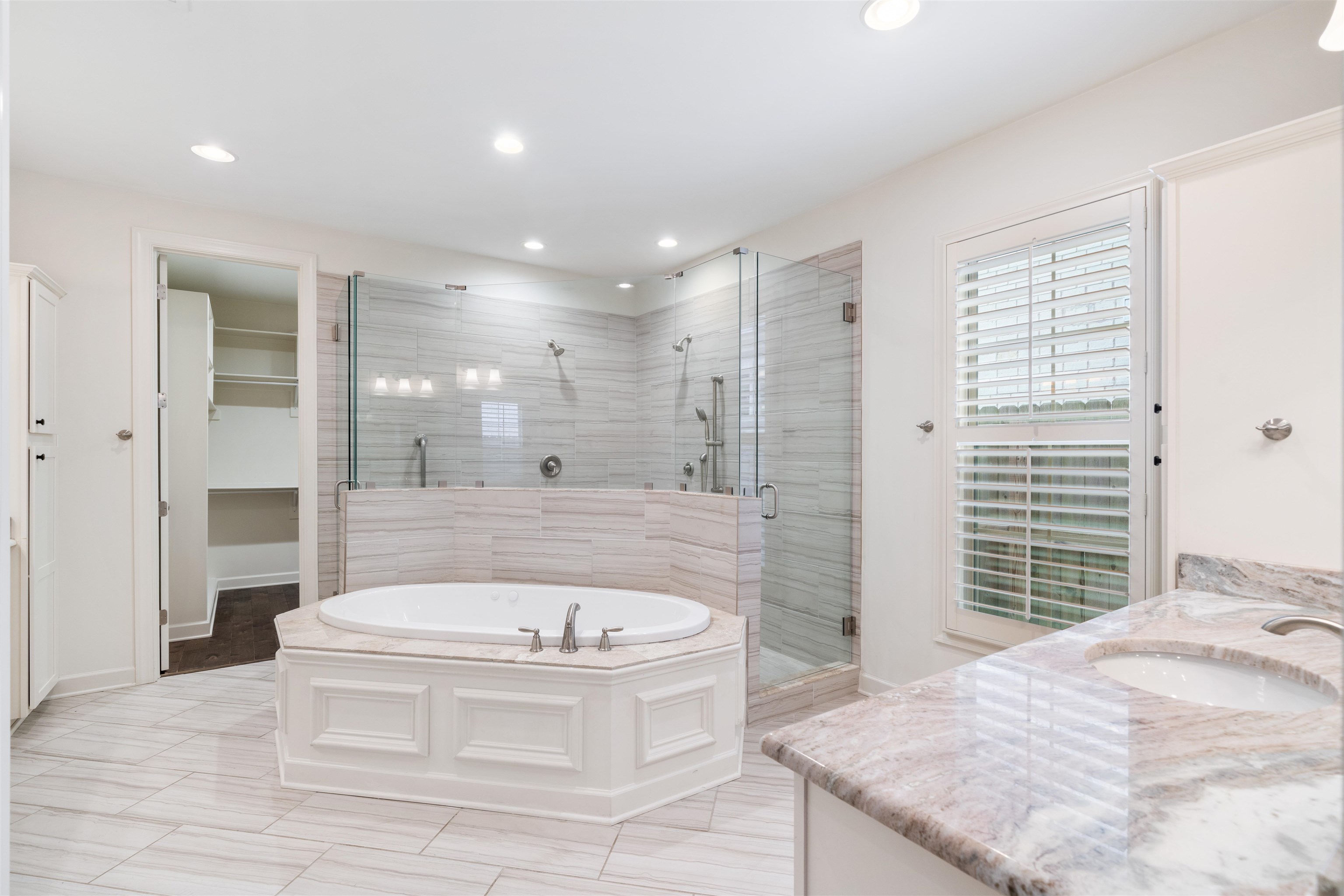 4713 Emmas Circle West Collierville, TN 38017 - Photo 12 of 28 a bathroom with a bathtub and a shower