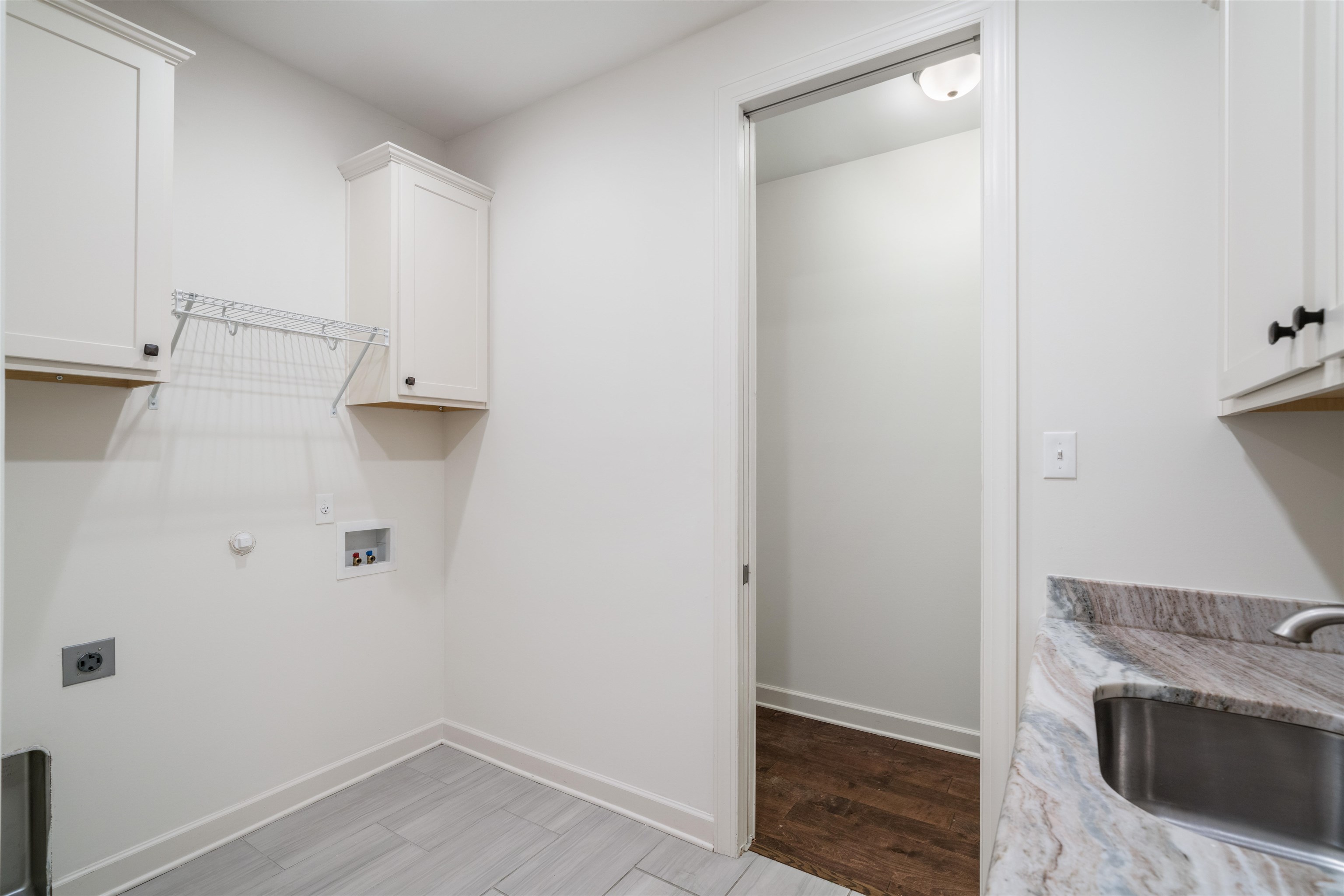 4713 Emmas Circle West Collierville, TN 38017 - Photo 16 of 28 a view of washer and dryer with wooden floor