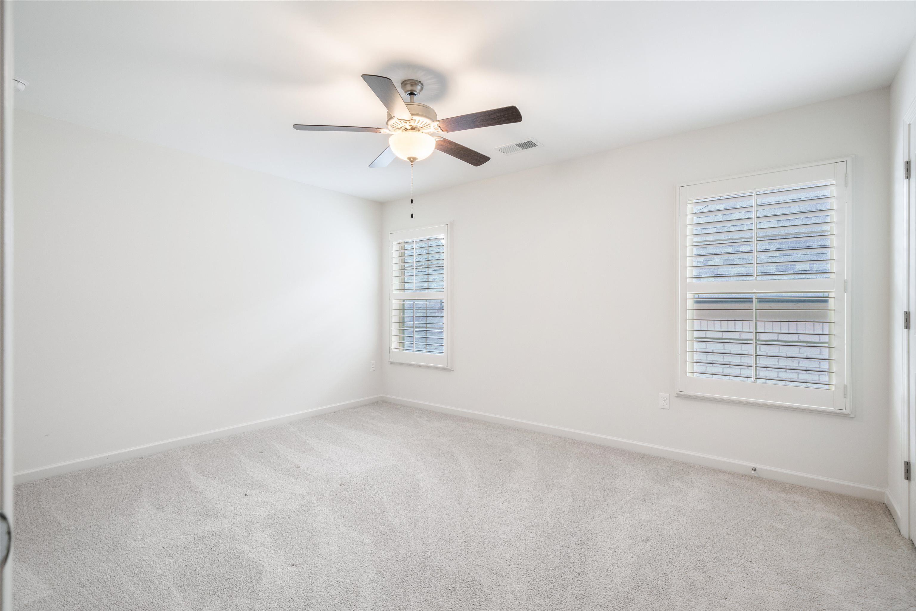 4713 Emmas Circle West Collierville, TN 38017 - Photo 23 of 28 an empty room with windows and fan