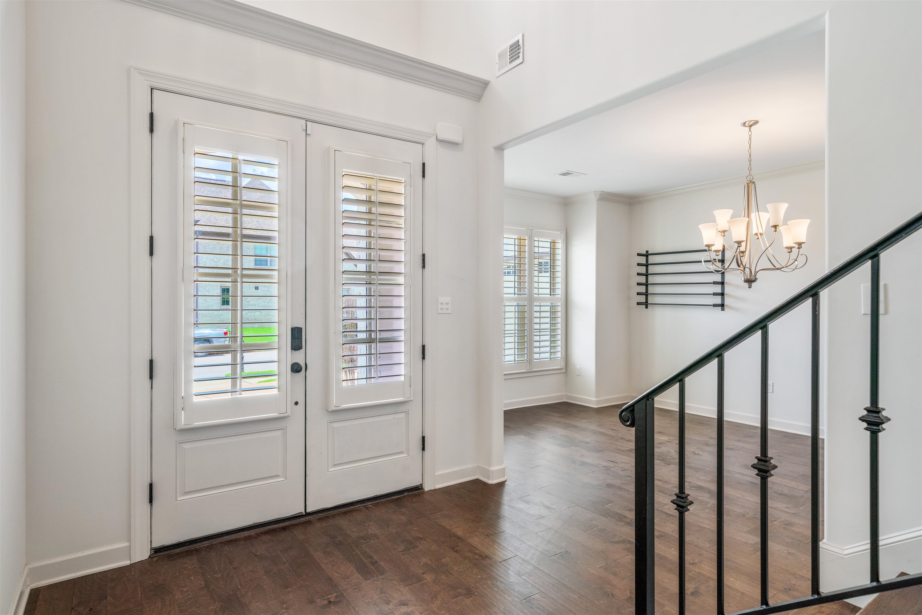 4713 Emmas Circle West Collierville, TN 38017 - Photo 4 of 28 a view of an empty room with wooden floor fan and windows