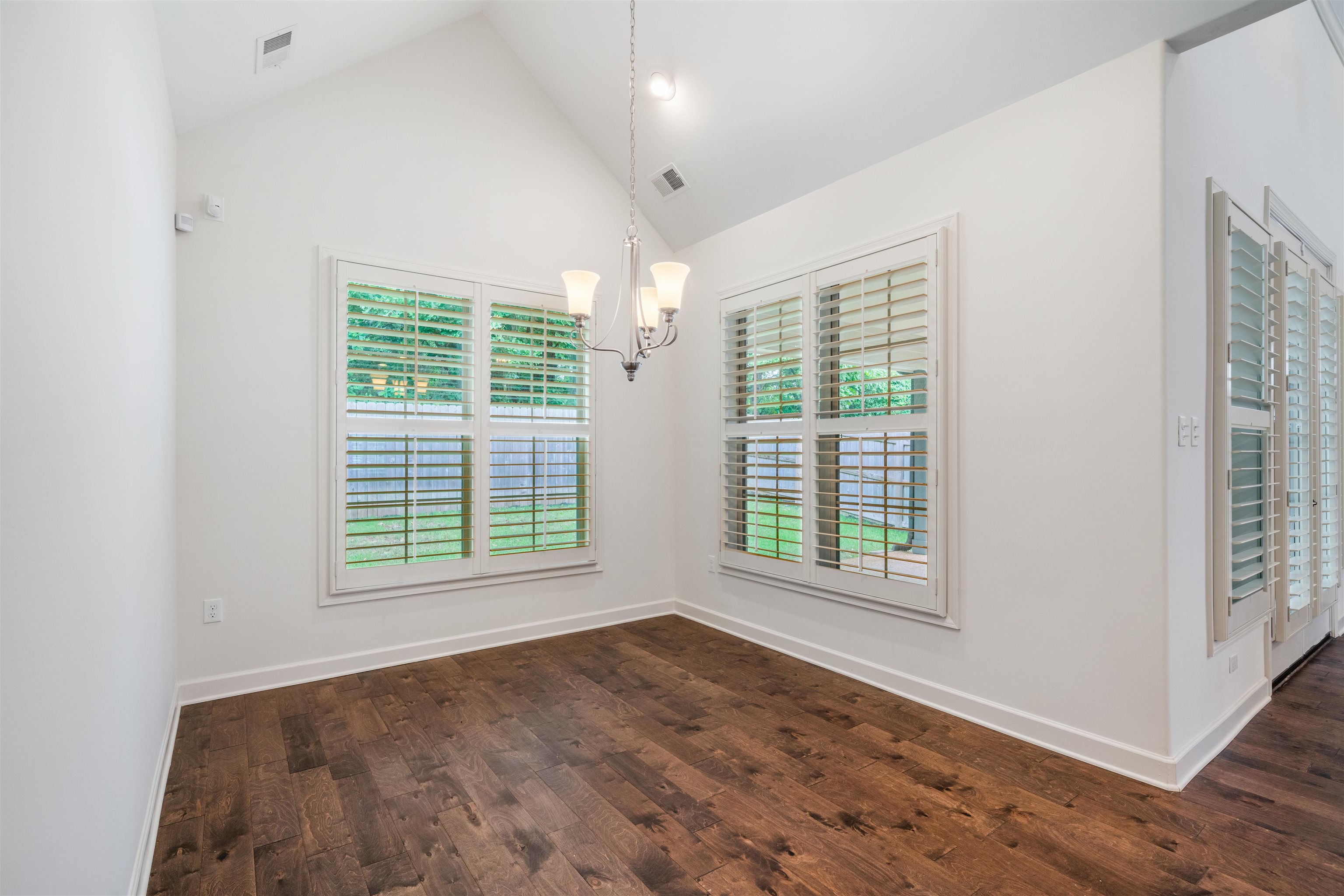 4713 Emmas Circle West Collierville, TN 38017 - Photo 7 of 28 an empty room with wooden floor and windows