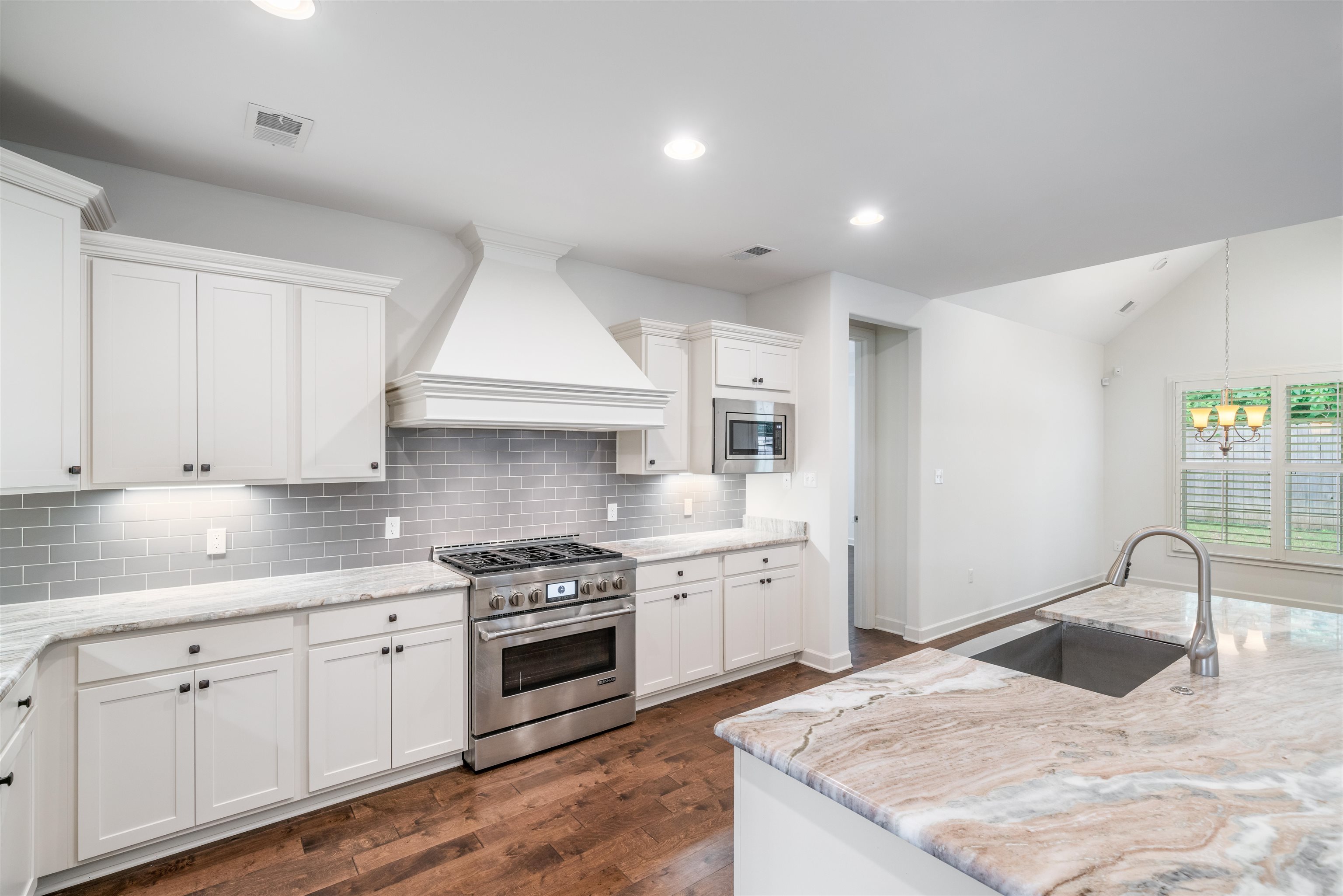4713 Emmas Circle West Collierville, TN 38017 - Photo 9 of 28 a kitchen with granite countertop a sink stainless steel appliances and cabinets
