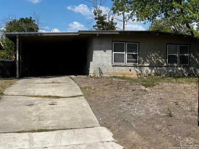 a backyard of a house with seating space