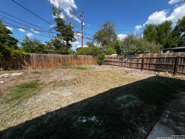 a view of backyard with green space