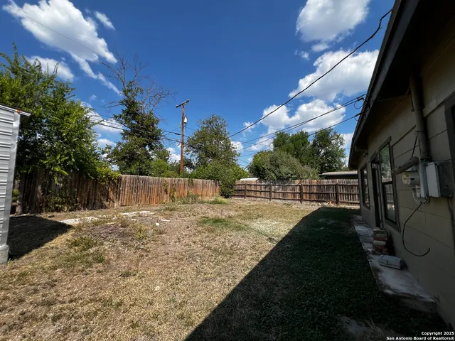 a backyard of a house with lots of green space