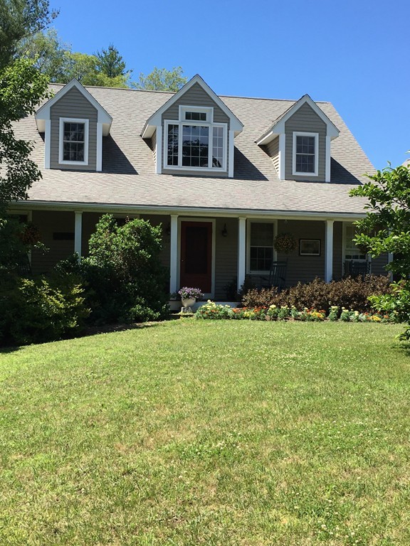 109 Fruitland Road Barre, MA 01005 - Photo 2 of 30 a front view of a house with a yard and trees