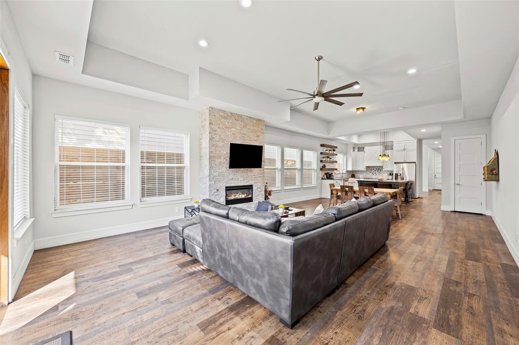 2011 North Prairie Avenue, Unit 2011 Dallas, TX 75204 - Photo 36 of 39 a living room with furniture a flat screen tv and a large window