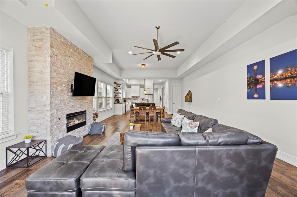 2011 North Prairie Avenue, Unit 2011 Dallas, TX 75204 - Photo 38 of 39 a living room with fireplace furniture and a flat screen tv