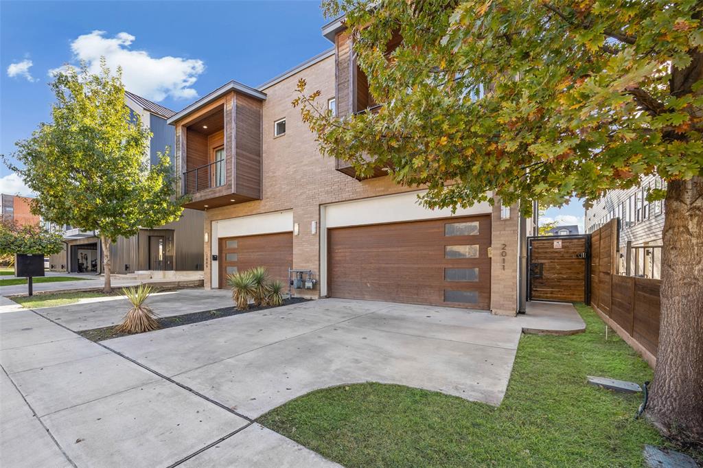 2011 North Prairie Avenue, Unit 2011 Dallas, TX 75204 - Photo 2 of 39 a view of a house with a yard and garage