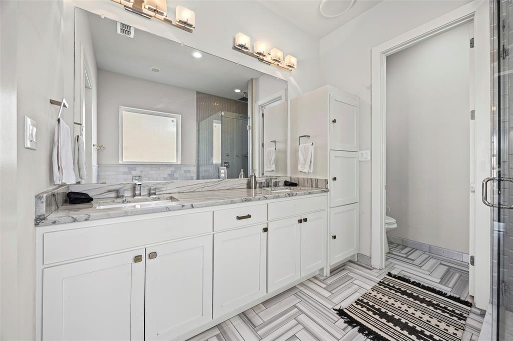 2011 North Prairie Avenue, Unit 2011 Dallas, TX 75204 - Photo 23 of 39 a spacious bathroom with double sink and a mirror