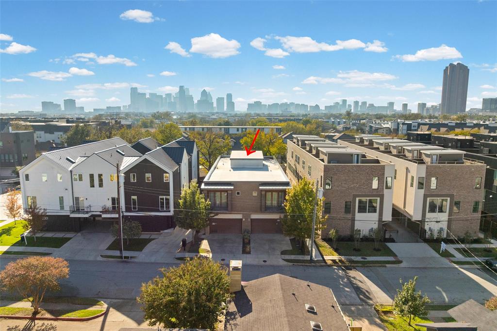 2011 North Prairie Avenue, Unit 2011 Dallas, TX 75204 - Photo 4 of 39 a front view of a house with a garden and lake view