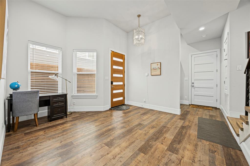 2011 North Prairie Avenue, Unit 2011 Dallas, TX 75204 - Photo 7 of 39 wooden floor in an empty room with a window