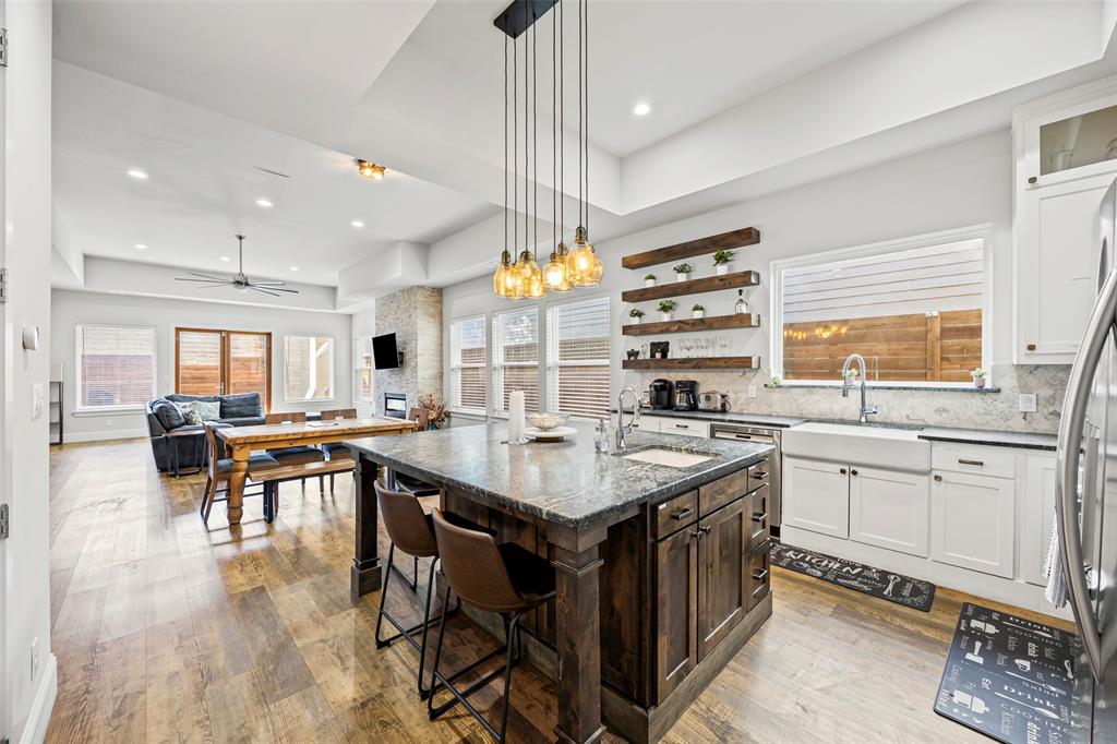 2011 North Prairie Avenue, Unit 2011 Dallas, TX 75204 - Photo 9 of 39 a kitchen with stainless steel appliances granite countertop a stove and a refrigerator