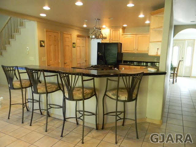 391 Butte Court Grand Junction, CO 81507 - Photo 4 of 11 a view of a chairs and table in a kitchen