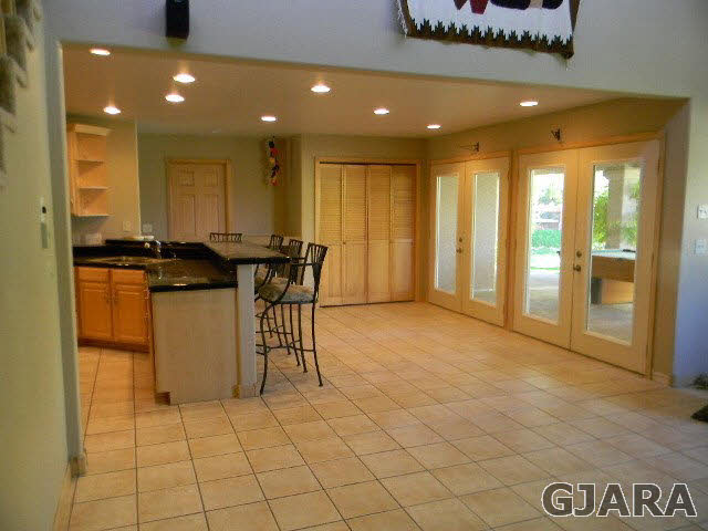 391 Butte Court Grand Junction, CO 81507 - Photo 5 of 11 a view of a hall with furniture and floor to ceiling window