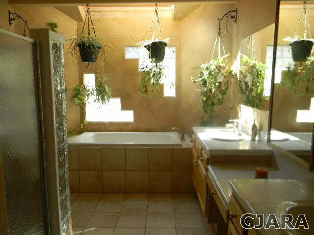 391 Butte Court Grand Junction, CO 81507 - Photo 9 of 11 a bathroom with a sink and mirror