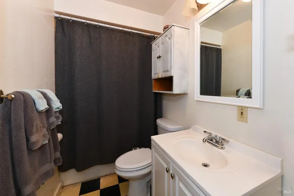 a view of an empty room with wooden walls