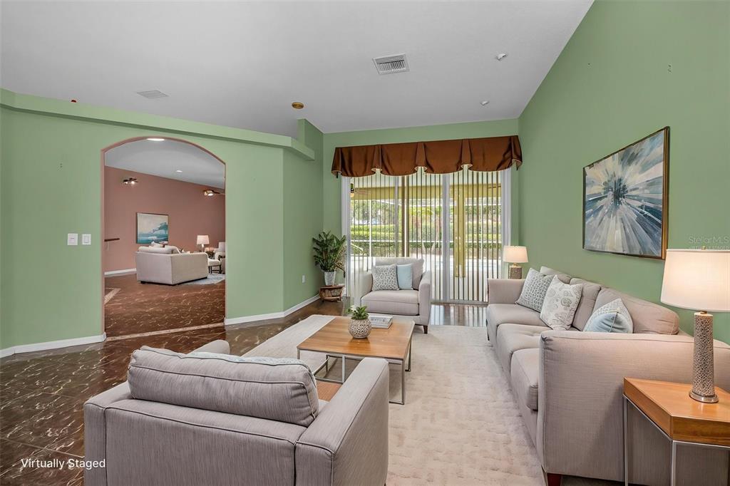 11917 Hadleigh Way Trinity, FL 34655 - Photo 13 of 84 a living room with furniture and a large window