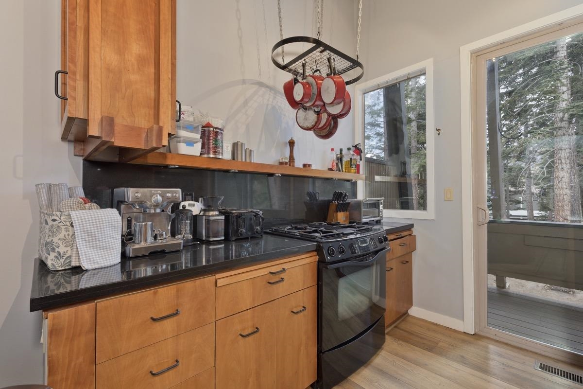 4 Kelley Road, Unit 5 Mammoth Lakes, CA 93546 - Photo 11 of 30 a kitchen with stainless steel appliances granite countertop a stove and a sink