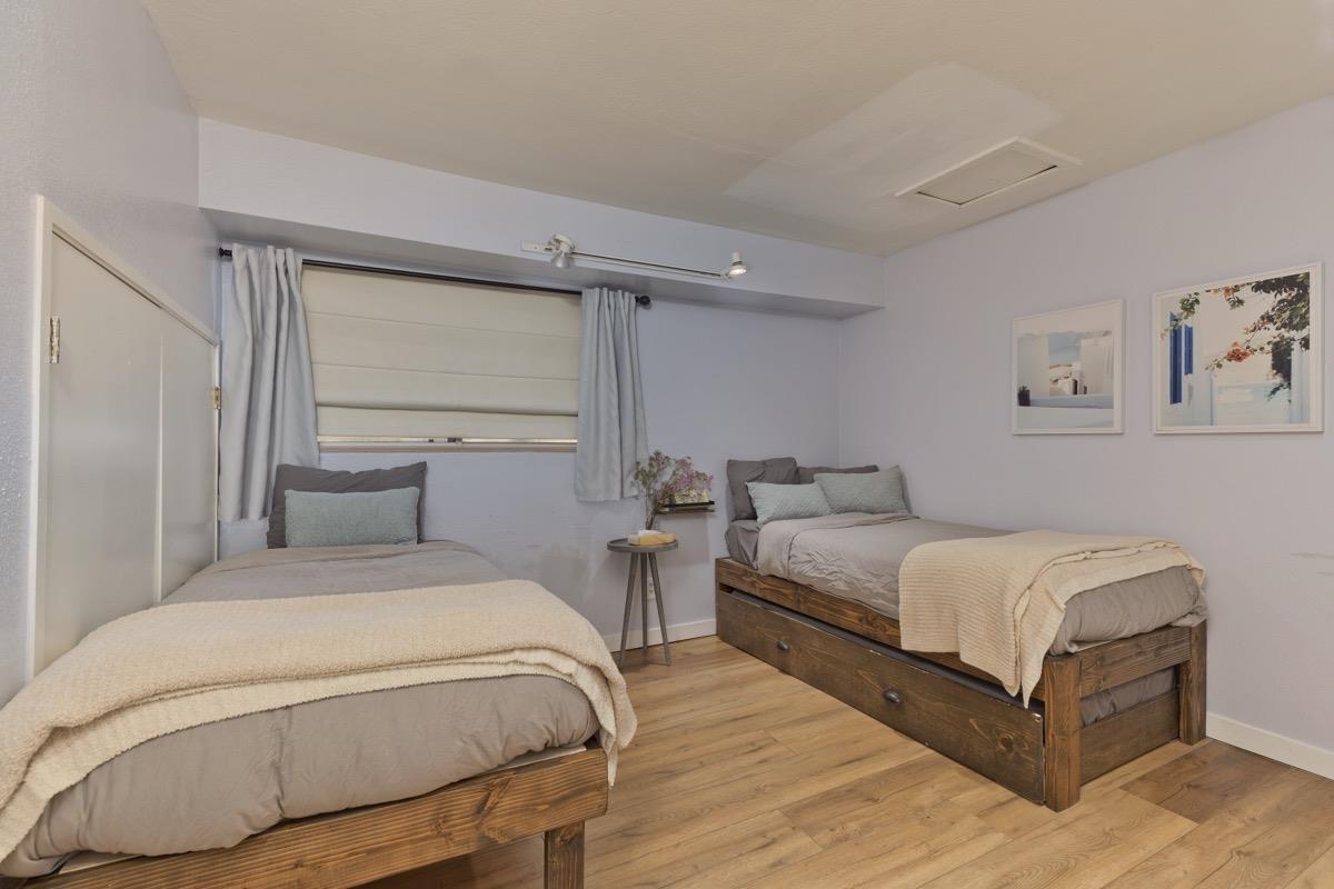 4 Kelley Road, Unit 5 Mammoth Lakes, CA 93546 - Photo 22 of 30 a bedroom with a bed and two windows